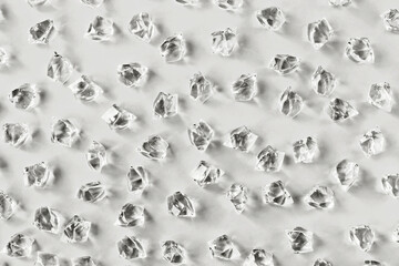 Pattern of ice pieces on Gray background. Selective focus. Demonstrating color of 2026 year, Cloud Dancer