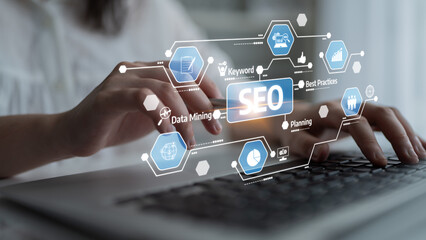 This image showcases a person engaging in SEO strategy development with digital tools, highlighting keyword planning and data analysis in a contemporary office setting. Tessel