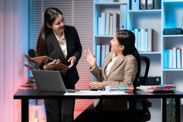 Collaboration and Idea Exchange: Two colleagues in a modern office space engage in a dynamic exchange, their animated discussion creating an atmosphere of innovation and teamwork.