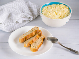 Whole grain baguette made from buckwheat flour and sesame seeds, and salad with egg