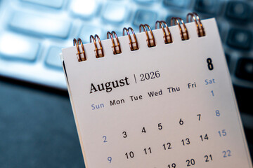 A close-up view of an August 2026 calendar page displayed on a textured surface, illustrating layout and design features. Ideal for planners, scheduling tools, and editorial use.