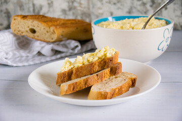 Sandwich with egg and delicious whole grain baguette with sesame seeds. Nutritious breakfast concept