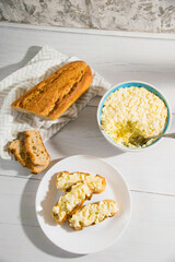 The process of preparing for the Christmas and New Year holidays. Making sandwiches with baguette, processed cheese and egg