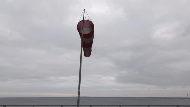 Tallinn, Estonia An extended  windsock in the wind in the port of Tallinn.  