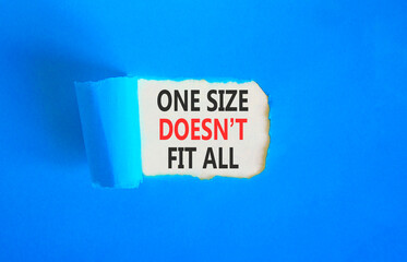One size does not fit all symbol. Concept words One size does not fit all on beautiful white paper. Beautiful blue paper background. Business one size does not fit all concept. Copy space.