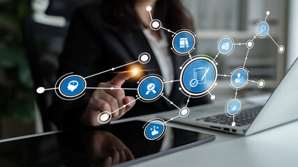 A business professional engages with a digital technology interface, highlighting modern e-commerce concepts and data management strategies in a corporate environment. Tessel