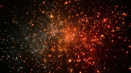 Festive explosion of vibrant golden and red fireworks sparks scatter across a dark night sky, abstract background for celebration, holiday, New Year's Eve, or Diwali concept.