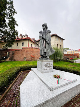Statue of General J&oacute;zef Bem in a historic Polish town square with a wreath in Tarnow, Poland.