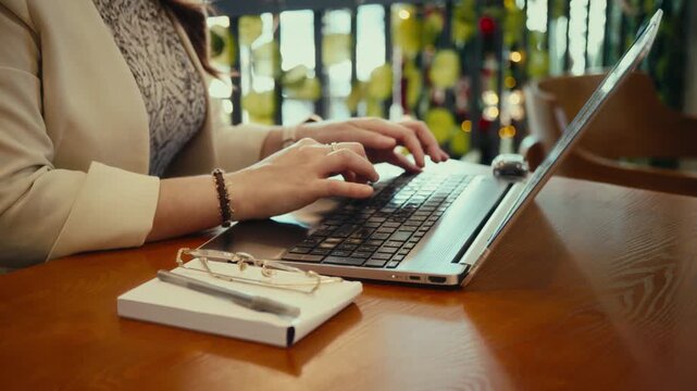 Slow motion typing on laptop, close-up
