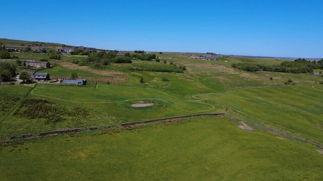 scenic aerial view of west yorkshire calderdale countryside near hebden bridge showing the village of blackshaw head surrounded by meadows in summer