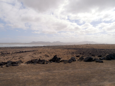 El Cotillo village - Fuerteventura island - Spain - December 4 2025 : Dramatic view of beautiful desert landscape, rugged coastline, beach and Atlantic Ocean.