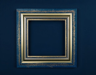 Luxury square picture frame with gold accents on deep black studio background for elegant New Year, holiday, and interior design mockup presentations