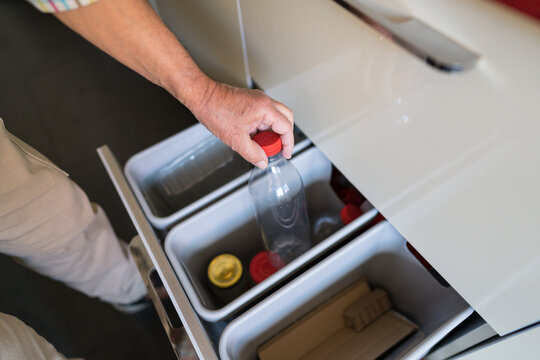 Senior practicing effective recycling at home