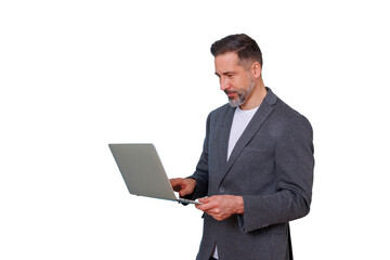 Businessman typing on a laptop, standing while working. Professional man using portable computer for communication and management
