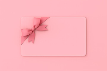 Pink gift card with a pink ribbon bow laying on a pink background for feminine celebration or beauty salon seasonal discount voucher mockup