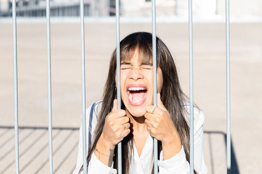 Young woman expressing frustration outside