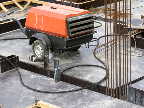 Portable compressor machine at a construction site
