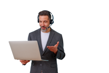 Man wearing an office headset and talking into his laptop, gesturing while participating in an online video conference
