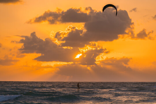 Kitesurfing during a vibrant sunset on Tulum beach