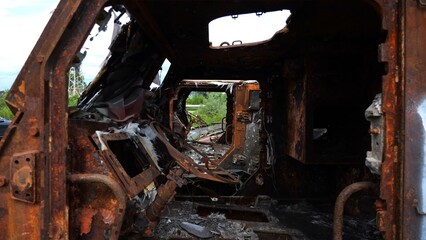 Rusty and burned-out armored vehicles on ukrainian territory. Exhibition of destroyed military equipment of the russian army. War between Ukraine and russia. Close up Slow motion