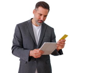 Mature man making online payment with credit card, using tablet for secure e-commerce shopping on transparent background