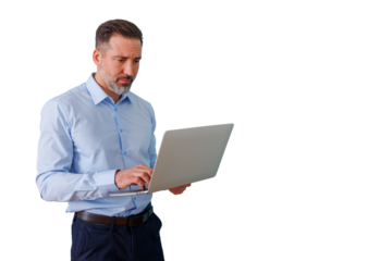 Focused businessman working on laptop, concentrating on problem-solving, standing against transparent background