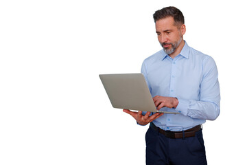 Mature businessman standing, using a laptop, typing and working remotely. Transparent background for versatile use