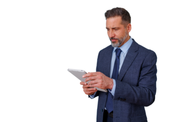 Senior businessman holding a tablet, engaging with technology. He is focused while using the device, on transparent background