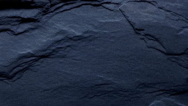 Deep blue natural slate stone texture close up with subtle glitter, abstract rock surface for construction and design background.