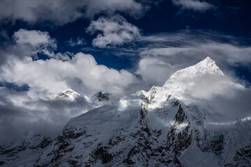 Nuptse and Everest mountains in clouds. Mahalangur Himal, the highest ridge in the world. View from Kala Patthar peak, Everest base camp trek, Nepal.