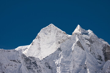 Kangtega and Thamserku peaks under blue sky. View from Thukla (Dughla) on Everest base camp trekking, Nepal.