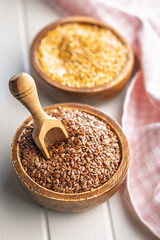 Linseed or flaxseed. Healthy flax seed in bowl on white table.
