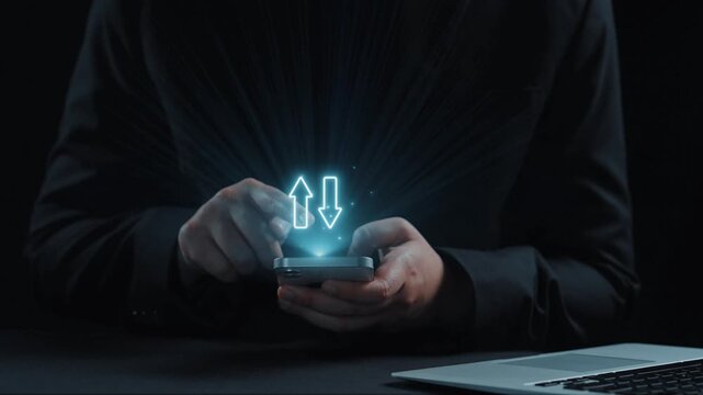 A businessman interacts with a smartphone showcasing digital arrows representing the relationship between quality and cost in contemporary business practices. Qubit