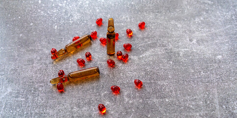 Vitamins in ampoules on the table.Medications for treatment.