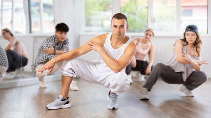 Break dance performed by a group of young dancers in a dance studio