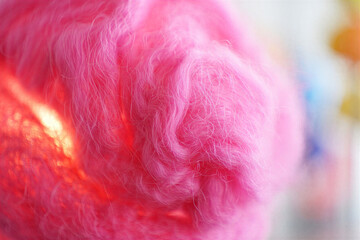 Knitted 3D shape ball of bright pink yarn with visible fibers and soft texture.