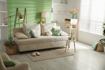 Living room with comfortable sofa and decor. Interior design