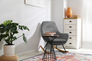Monstera houseplant and stylish furniture at home. Interior design © New Africa