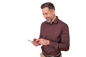 Middle-aged man smiling, holding a tablet and touching the screen, interacting with digital technology for online activity. Transparent background