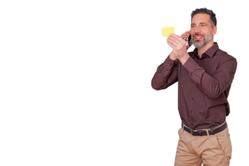 Man holding a phone to his ear and a blank yellow sticky note, conveying a message or reminder while on a call
