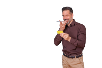Smiling man recording voice message on smartphone while holding yellow business card, connecting and networking on transparent background