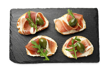 Delicious bruschettas with cream cheese, prosciutto, green olives and arugula isolated on white, top view