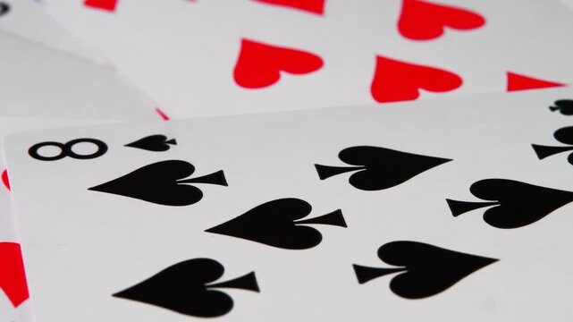 Close up rotating playing cards captured in smooth motion. video emphasizes chance, risk, strategy, ideal for casino promotions, game intros, advertising visuals