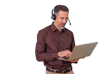 Man wearing headset with microphone using laptop, working in call center, providing customer support, transparent background