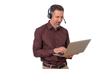 Man wearing headset with microphone using laptop, working in call center, providing customer support, transparent background