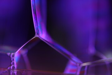 Purple liquid surface, phenomenal structure, green oils on a dark background, colourful abstract, surrealistic art, iridescent effect