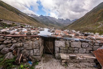 A house in the highlands of the Eastern Black Sea region where livestock breeders stay during the summer months, with a view of the mountains...