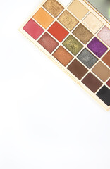 A vibrant makeup palette stands out against a white background. 