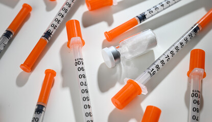 Close up of Single Use Syringes with Glass Vial of Medicine