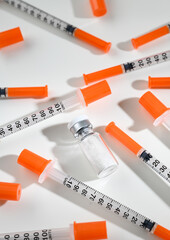 Clear Glass Vials Next to Single Use Syringes